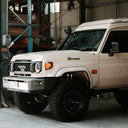 Beige Toyota SUV in a warehouse setting