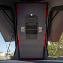 Wall panel with speakers and ventilation in a vehicle interior