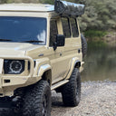 Close up of the vehicle off-road near water.