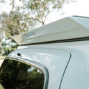 Roof rack on a vehicle with trees in the background