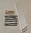 Set of tent poles and ropes on a concrete surface